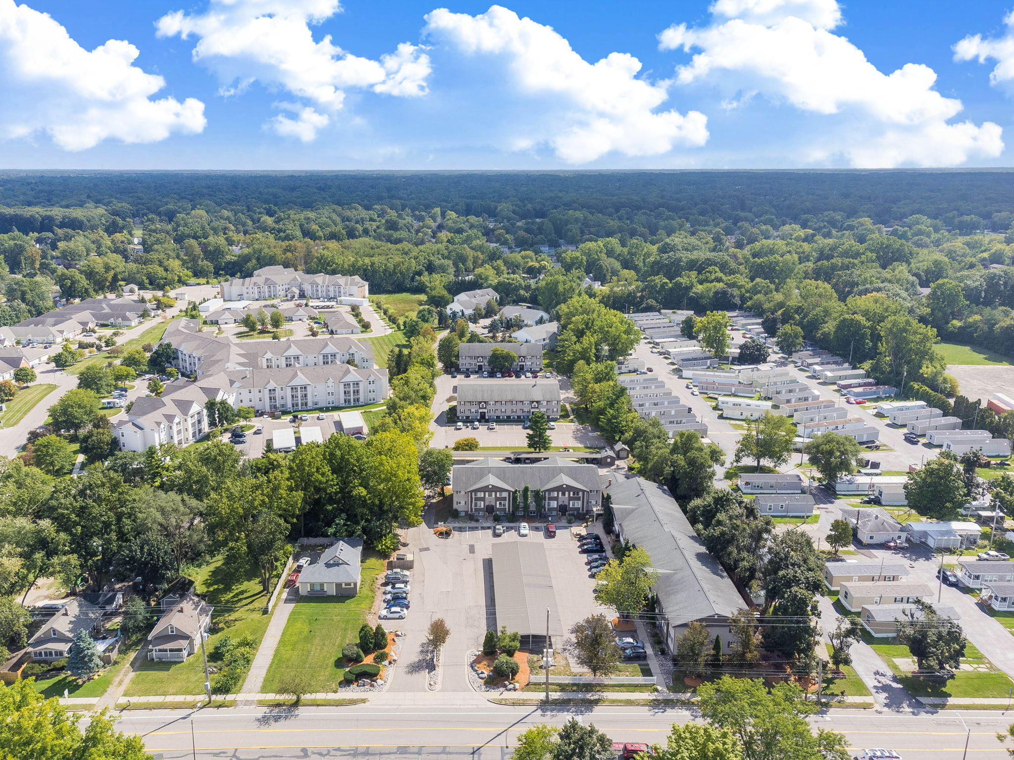 A bird's eye view of a residential area with a large building in the center.